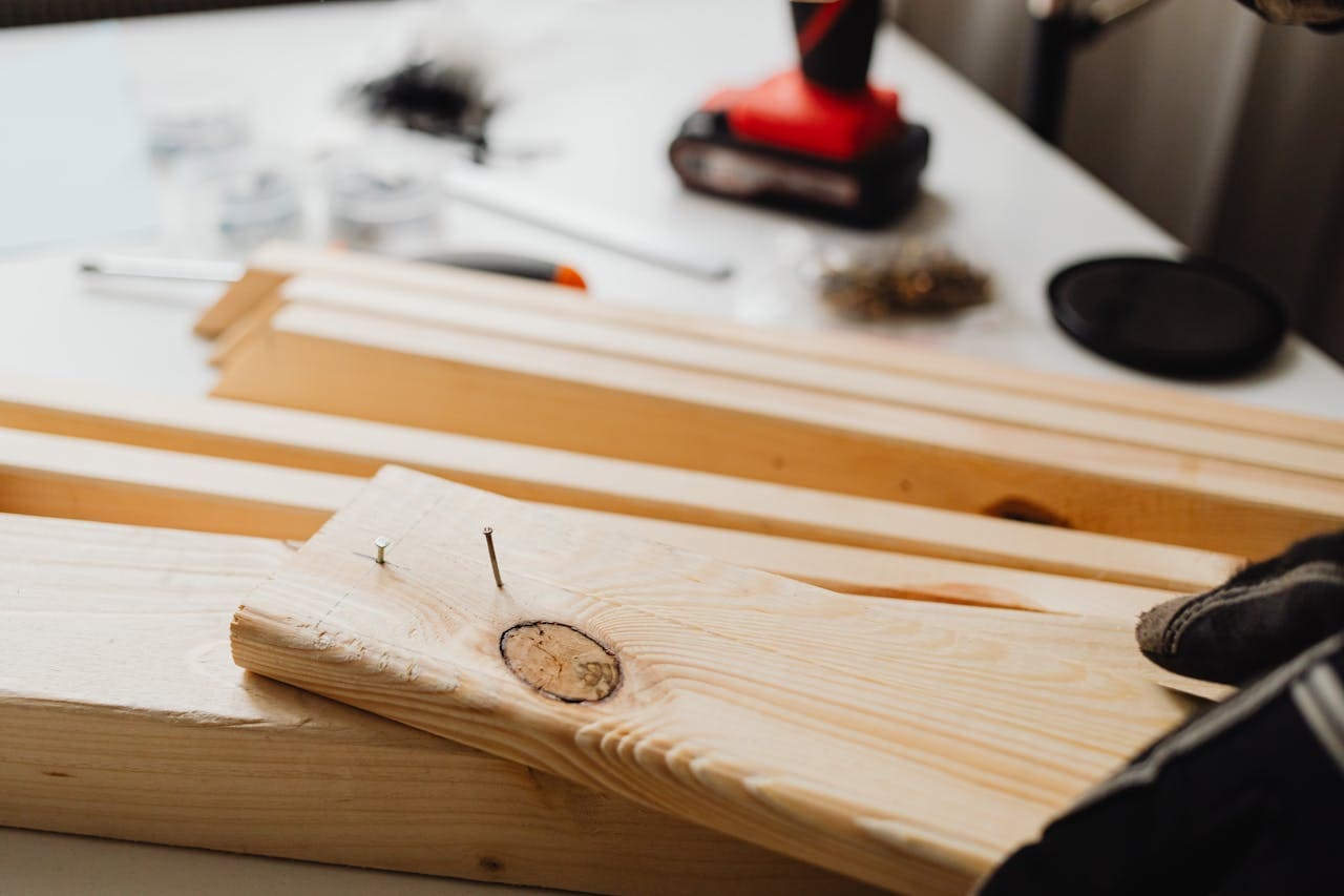 The Art of Drawing Readers In: Your attractive post title goes here Close-up of woodworking, showing a power drill and wooden planks for DIY projects.